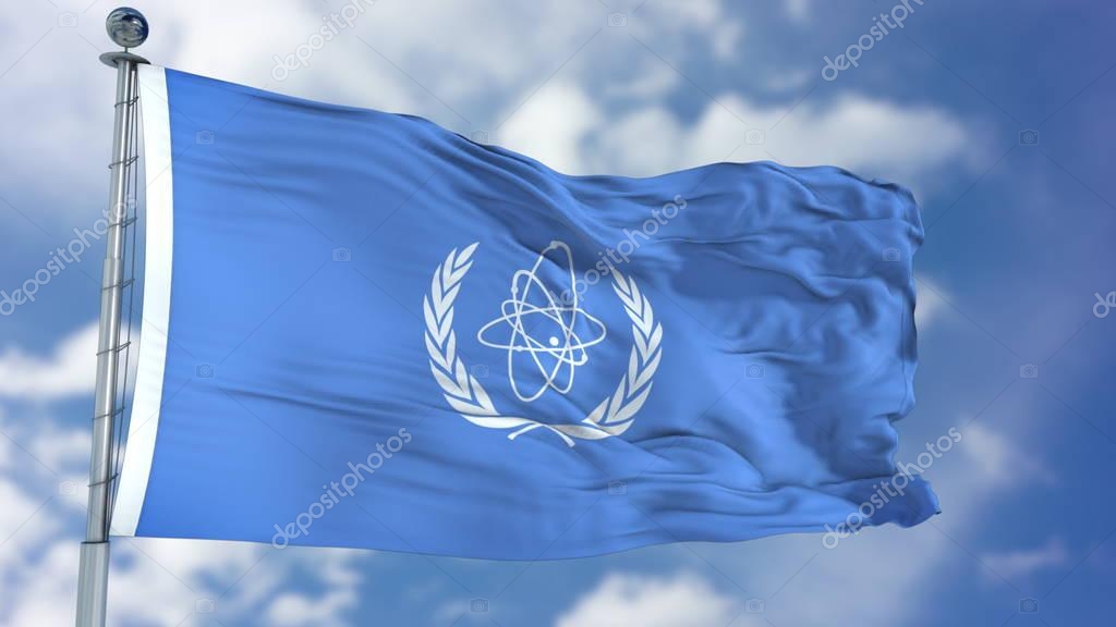International Atomic Energy Agency IAEA flag waving against clear blue sky, close up, isolated with clipping path mask luma channel, perfect for film, news, composition