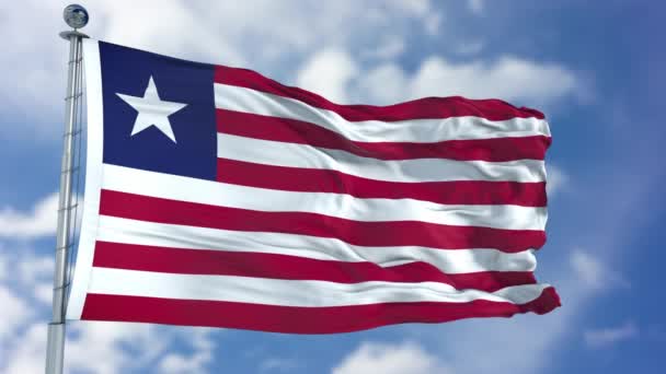 Vlag van Liberia in een blauwe hemel — Stockvideo