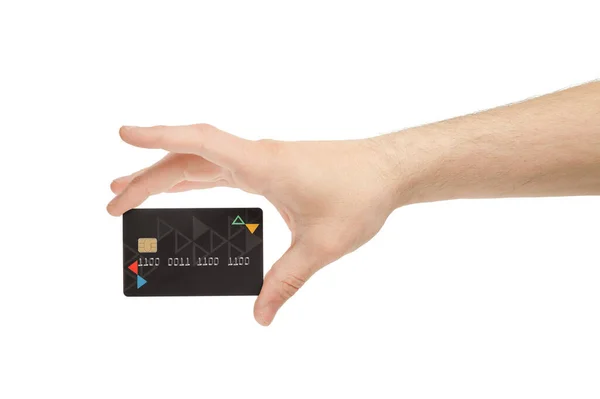 Fechar de uma mão segurando um cartão de crédito preto em um fundo branco . — Fotografia de Stock