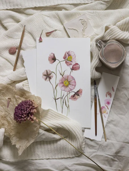 Workspace. Wild flower painted with watercolor, paintbrush, isolated on white background. Overhead view. Flat lay, top view. — Stock Photo, Image