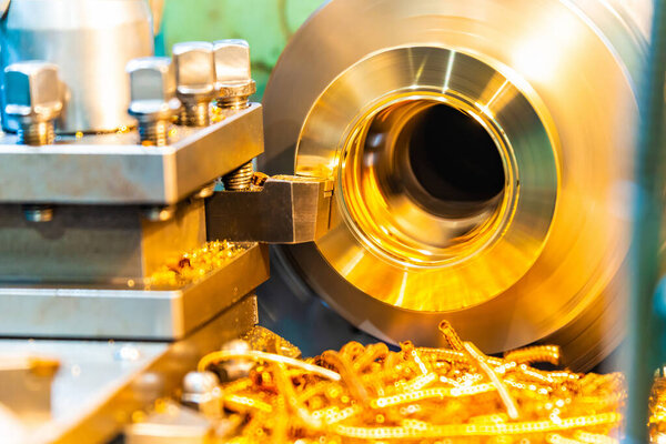 Bronze on a lathe, processing and manufacturing of parts from brass on a CNC machine.