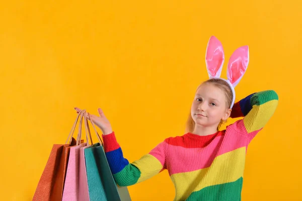 Girl Bunny Ears Colorful Clothes Holds Shopping Bag Her Hand — Stock Photo, Image