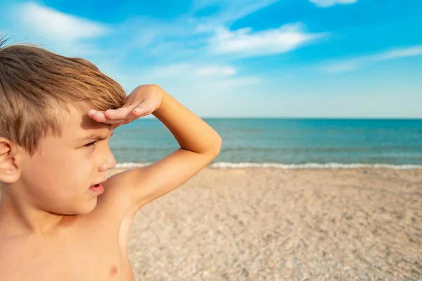 Boy Looks Distance Covering His Face His Hand Sun Beach — ストック写真