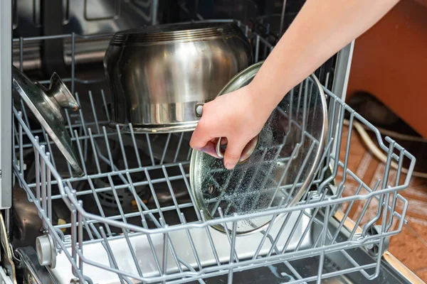 Girl Loads Dirty Dishes Dishwasher Forks Plates Crutches Washing Disinfection — Stock Photo, Image