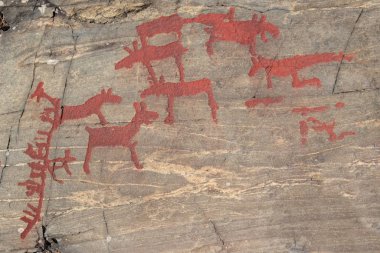 Ancient rock paintings in Naesaaker ins Sweden clipart
