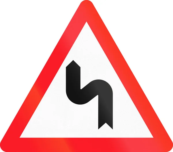 Señal de advertencia utilizada en Suiza doble curva, primero a la izquierda — Foto de Stock