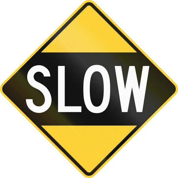 An older version of the road sign in the United States warning drivers to proceed slowly or slow down — Stock Photo, Image