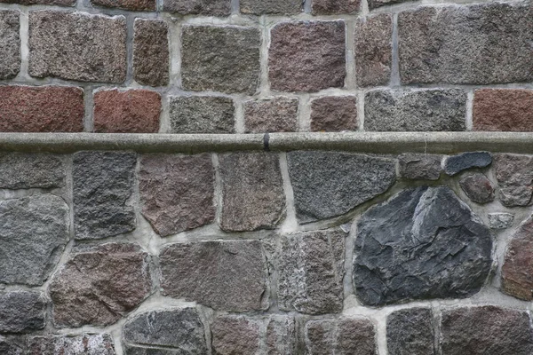 Parede de pedra com uma borda horizontal e dois estilos — Fotografia de Stock