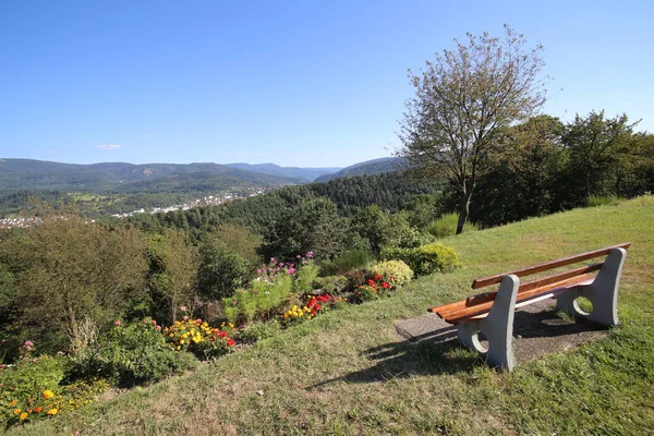 Bench providing an outlook over the city of Gaggenau, Baden-Wurttemberg, Germany — Stock Photo, Image