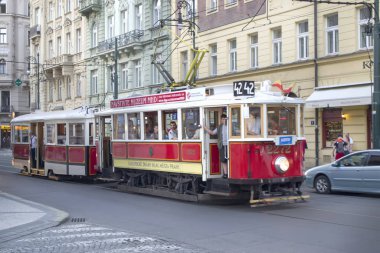 Old tram on the streets of Prague. Inscription in Chech: visit museum mdh, electric railroad heads, city Prague.