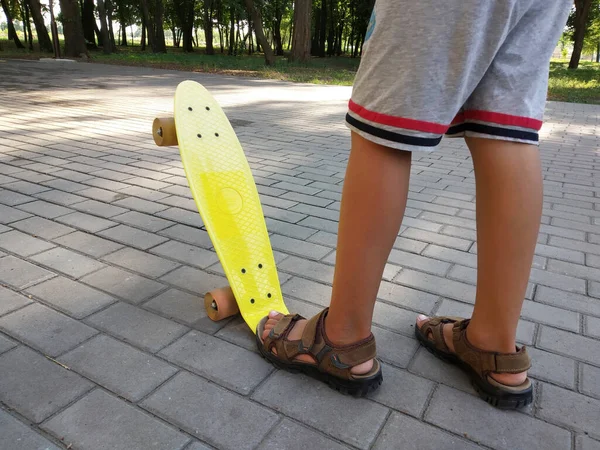 Feet Little Boy Brown Sandals Yellow Children Skateboard Park Close — Stock Photo, Image