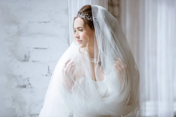 Brunette bride in fashion white wedding dress with makeup — Stock Photo, Image