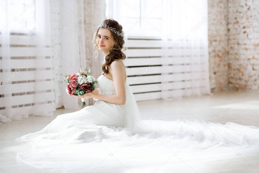 Brunette bride in fashion white wedding dress with makeup