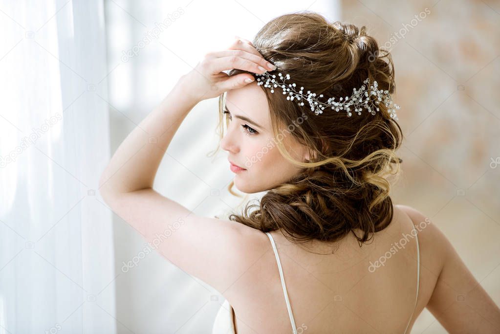 Brunette bride in fashion white wedding dress with makeup