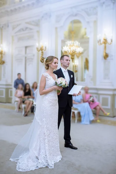 Beauty bride and handsome groom are registering the marriage — Stock Photo, Image