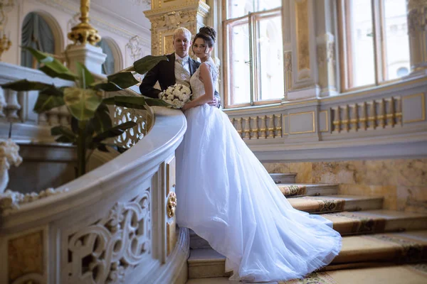 Wedding couple indoors is hugging each other — Stock Photo, Image