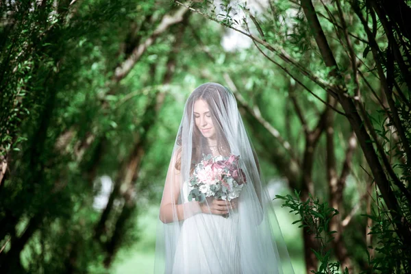 Brunette bride in fashion white wedding dress with makeup — Stock Photo, Image