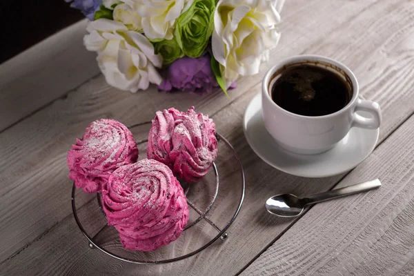 Black coffee and pink zephyr. marshmallow. Sweet pink marshmallow - zephyr and cup of Coffee. Christmas Still Life. Winter drink theme. Romance. Provencal still life. Good morning