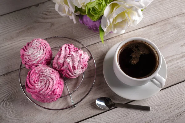 Black coffee and pink zephyr. marshmallow. Sweet pink marshmallow - zephyr and cup of Coffee. Christmas Still Life. Winter drink theme. Romance. Provencal still life. Good morning