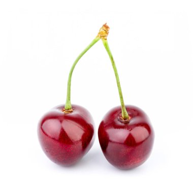 İzole kiraz. Kırpma yolu ile beyaz arka plan üzerinde izole kiraz meyve. Tatlı beyaz izole kiraz