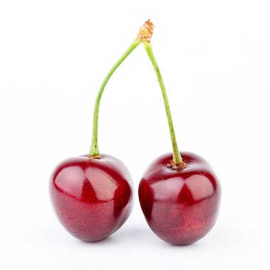 İzole kiraz. Kırpma yolu ile beyaz arka plan üzerinde izole kiraz meyve. Tatlı beyaz izole kiraz