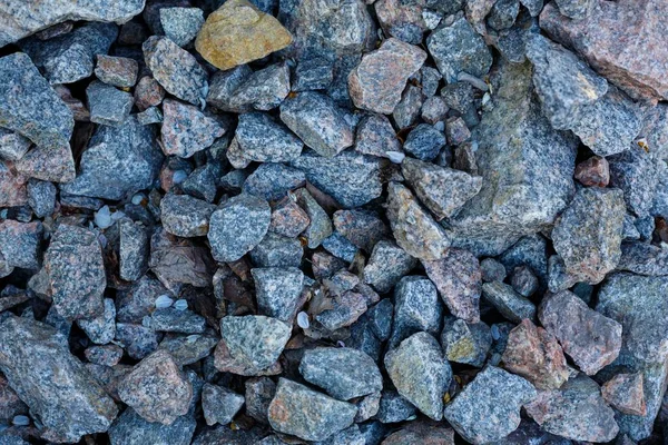 Granit çakıl doku. İnşaat malzemeleri. çakıl, ezilmiş taş, taş. gri granit çakıl arka plan karışım beton İnşaat endüstri için yukarıya kapatmak
