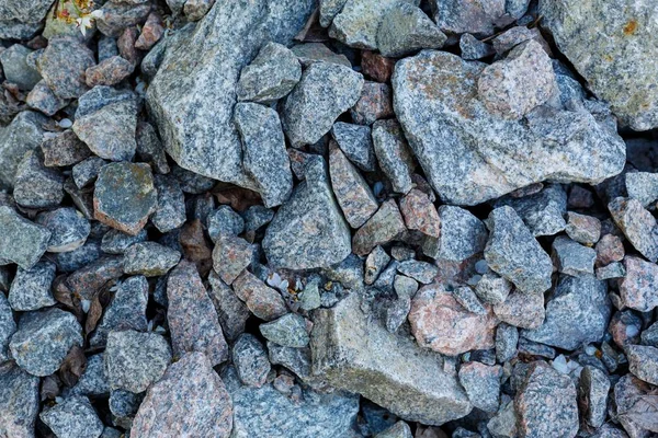 Granit çakıl doku. İnşaat malzemeleri. çakıl, ezilmiş taş, taş. gri granit çakıl arka plan karışım beton İnşaat endüstri için yukarıya kapatmak