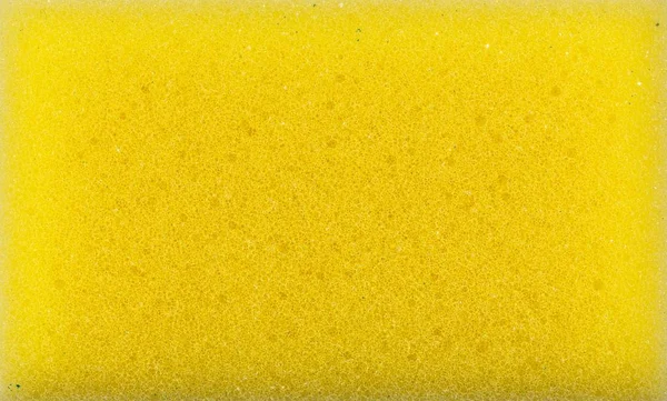 Fondo de textura de esponja. material polimérico con una estructura de espuma. Cierre la almohadilla de lavado de color. Fondo de textura de esponja abrasiva . — Foto de Stock