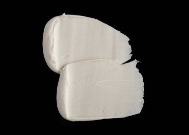 Yapısal Alçı beyaz siyah bir arka plan. Beyaz krema. boya karalama. Hamuru.