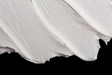 Yapısal Alçı beyaz siyah bir arka plan. Beyaz krema. boya karalama. Hamuru