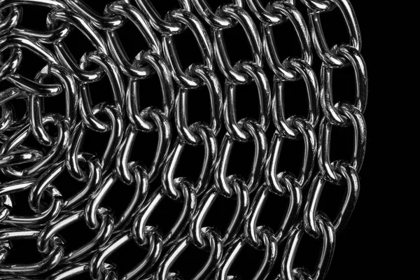 Chain heap - abstract metal background. Collection silver jewelry chains on an isolated black background. Set of different lenght metal chain. Accessories. Bijouterie. Silver.