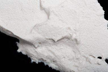 Yapısal Alçı beyaz siyah bir arka plan. Beyaz krema. boya karalama. Hamuru