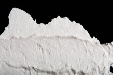 Yapısal Alçı beyaz siyah bir arka plan. Beyaz krema. boya karalama. Hamuru