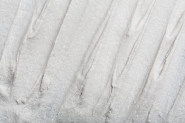 Yapısal Alçı beyaz siyah bir arka plan. Beyaz krema. boya karalama. Hamuru