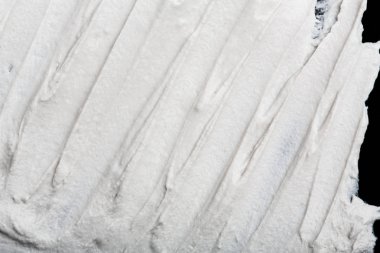 Yapısal Alçı beyaz siyah bir arka plan. Beyaz krema. boya karalama. Hamuru