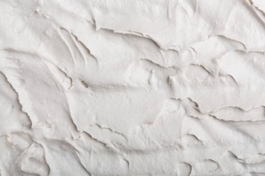 Yapısal Alçı beyaz siyah bir arka plan. Beyaz krema. boya karalama. Hamuru