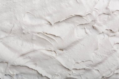 Yapısal Alçı beyaz siyah bir arka plan. Beyaz krema. boya karalama. Hamuru