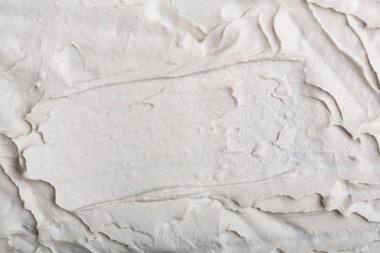 Yapısal Alçı beyaz siyah bir arka plan. Beyaz krema. boya karalama. Hamuru