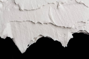 Yapısal Alçı beyaz siyah bir arka plan. Beyaz krema. boya karalama. Hamuru