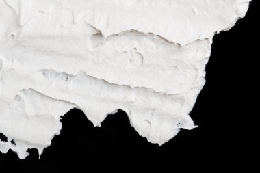 Yapısal Alçı beyaz siyah bir arka plan. Beyaz krema. boya karalama. Hamuru