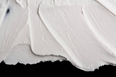Yapısal Alçı beyaz siyah bir arka plan. Beyaz krema. boya karalama. Hamuru