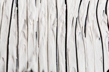 Yapısal Alçı beyaz siyah bir arka plan. Beyaz krema. boya karalama. Hamuru