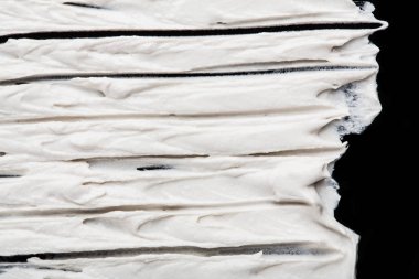 Yapısal Alçı beyaz siyah bir arka plan. Beyaz krema. boya karalama. Hamuru