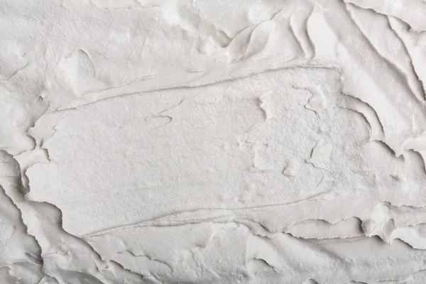 Yapısal Alçı beyaz siyah bir arka plan. Beyaz krema. boya karalama. Hamuru