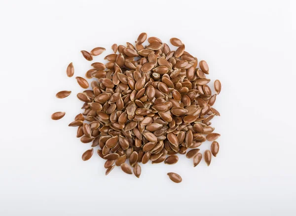 Close up of flax seeds isolated on white background. Bowl full of brown flaxseed or linseed. Cereals. Vitamins. Healthy food. — Stock Photo, Image