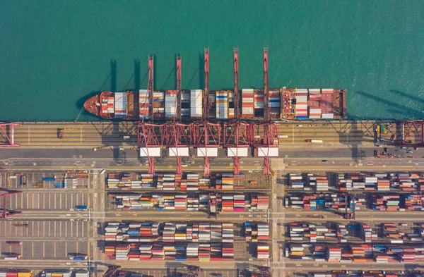 Top view of international port with Crane loading containers in