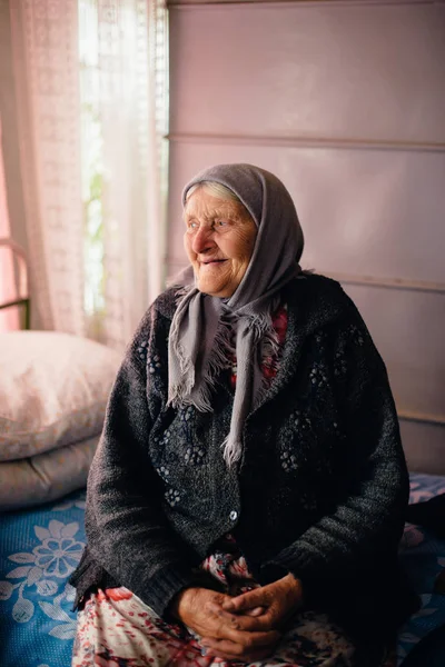 The old grandmother at home in Russian village