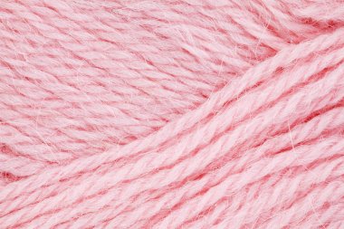 Görüntü pembe yün iplik örme için yakından. Arka plan
