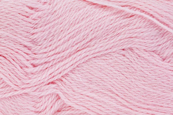 Ein Nahaufnahme-Bild rosa von Wollgarn zum Stricken. Hintergrund — Stockfoto