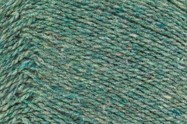 Ein Nahbild grün aus Wollgarn zum Stricken. Hintergrund — Stockfoto